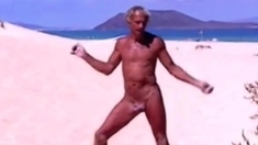 Tanned guy on beach in tiny string thong (temporarily!)