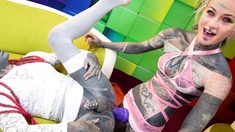 Tattooed trans sissy gets ass fucked with a strap-on