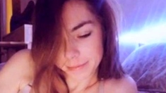 Busty babe playing with her big boobs