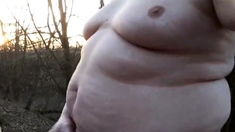 Chubby masturbates in the woods